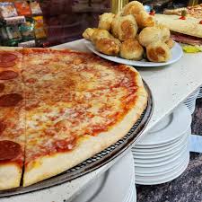 Pasquale’s Italian Restaurant and Pizzeria signature dishes New York Style PizzaChicken ParmigianaBaked Ziti